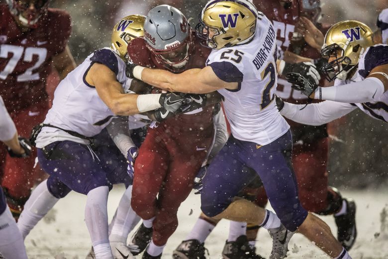 Washington Huskies linebacker Ben Burr-Kirven tackling a record