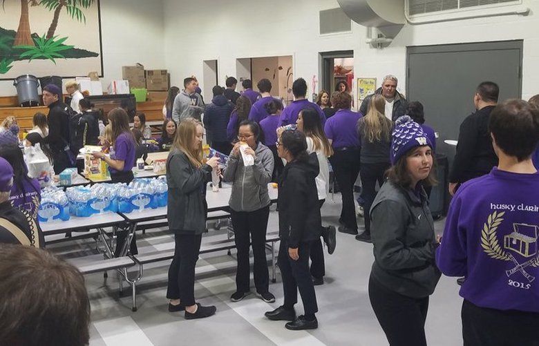 Families left their thanksgiving dinners and hot food for University of Washington marching band members after their bus rolled over on I-90 on Thursday.
