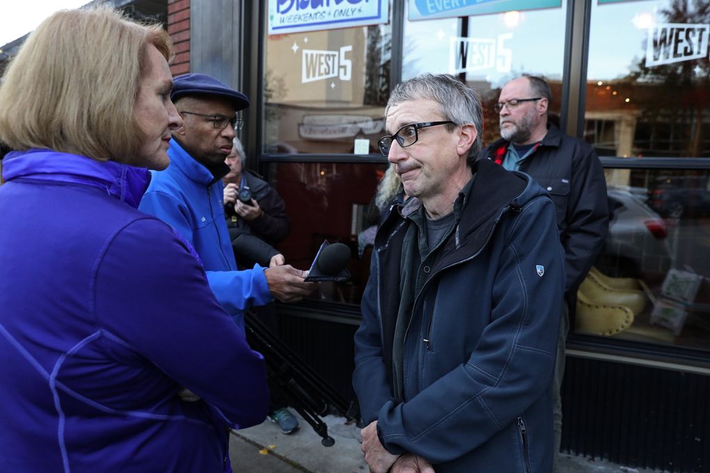 Seattle Mayor Jenny Durkan, who is coming up on a year in office, spoke to Dave Montoure, co-owner of restaurant West 5, during a neighborhood tour in West Seattle, Monday, Nov. 12, 2018. Montoure asked for more policing. (Ken Lambert / The Seattle Times)