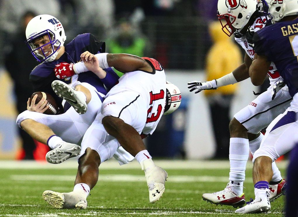Washington quarterback Jake Browning is sacked by Utah’s Gionni Paul in 2015. (John Lok / The Seattle Times)