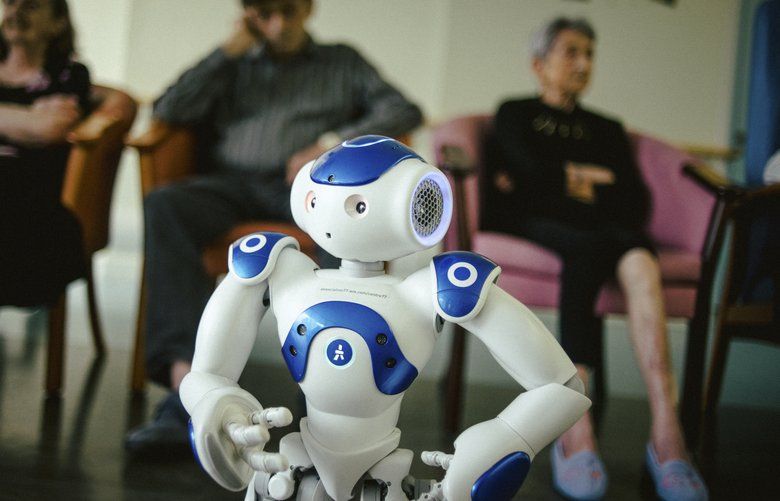 A robot named Zora during a group therapy session at Jouarre, a nursing facility an hour outside Paris, on Aug. 30, 2018. It may not look like much — more cute toy than futuristic marvel — but this robot is at the center of an experiment in France to change care for elderly patients. (Dmitry Kostyukov/The New York Times) 