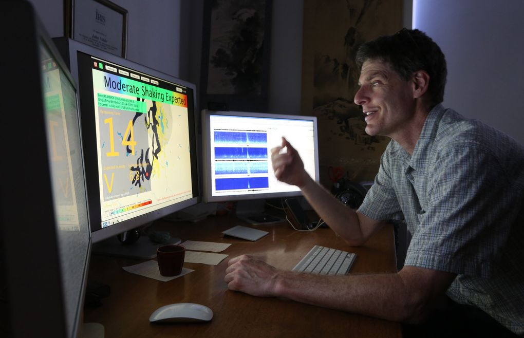 John Vidale, the former director of the Pacific Northwest Seismic Network is showing the alerts on his computer screen after an early warning seismic network receives signals that a quake will hit. (Steve Ringman / The Seattle Times)
