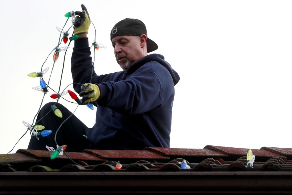 Holiday-light installation company Clear N’ Bright Windows uses commercial-grade, LED lights without a fuse that can operate for years in a wet climate without needing to be replaced. (Erika Schultz / The Seattle Times)