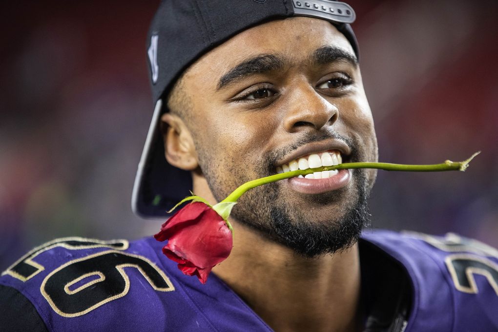Salvon Ahmed celebrates Washington’s berth into the Rose Bowl. (Dean Rutz / The Seattle Times)