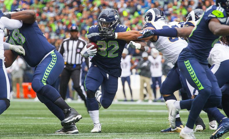 Running back Chris Carson of the Seattle Seahawks runs a pass route