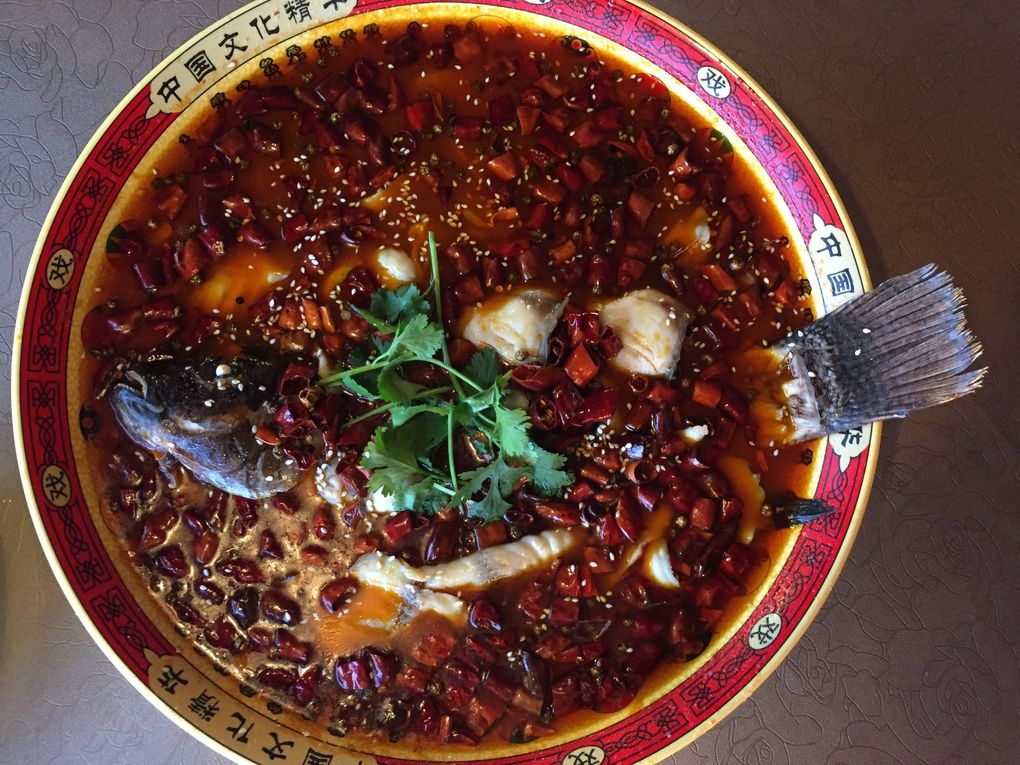 Zhen Kee’s boiling whole fish in hot chili oil stole the show. (Bethany Jean Clement / The Seattle Times)