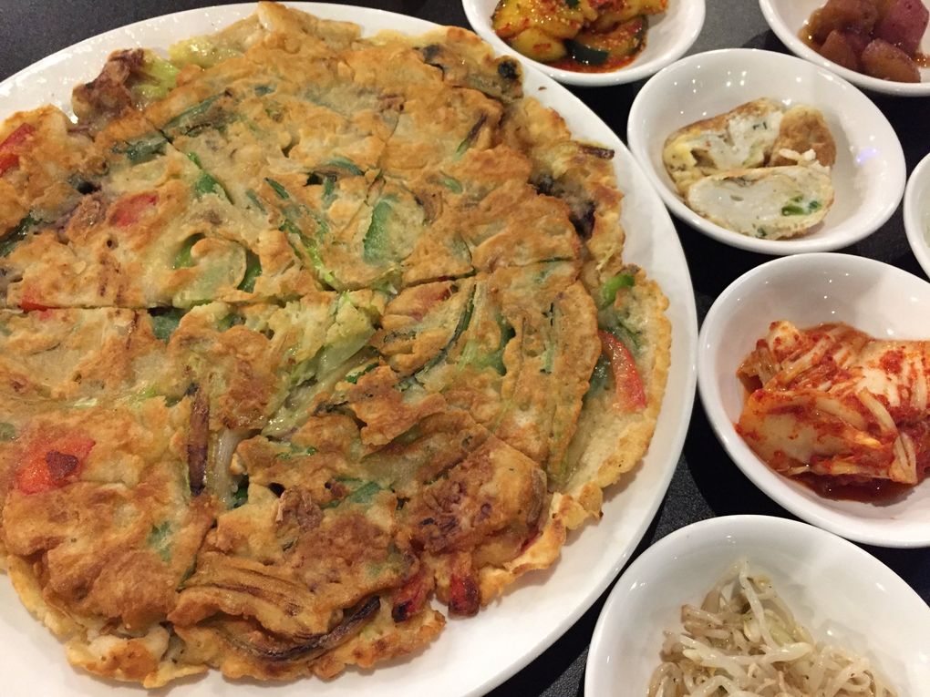 At Stone Korean Restaurant — already a favorite in Redmond, brand-new on Dexter in Seattle — the excellent, huge and filling seafood pancake is loaded with fresh-tasting shrimp, octopus and squid. (Bethany Jean Clement / The Seattle Times)