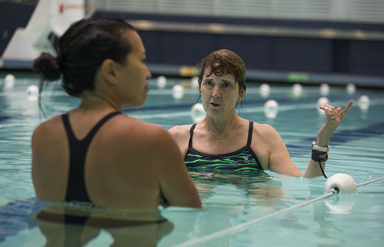 Wed., October 10, 2018.   FIT FOR LIFE COLUMN     Kathie Flood giving Nicole Tsong some of the requirements you must pass before completeing the course in lifeguarding.  They are at the Bellevue Aquatic Center.   207960