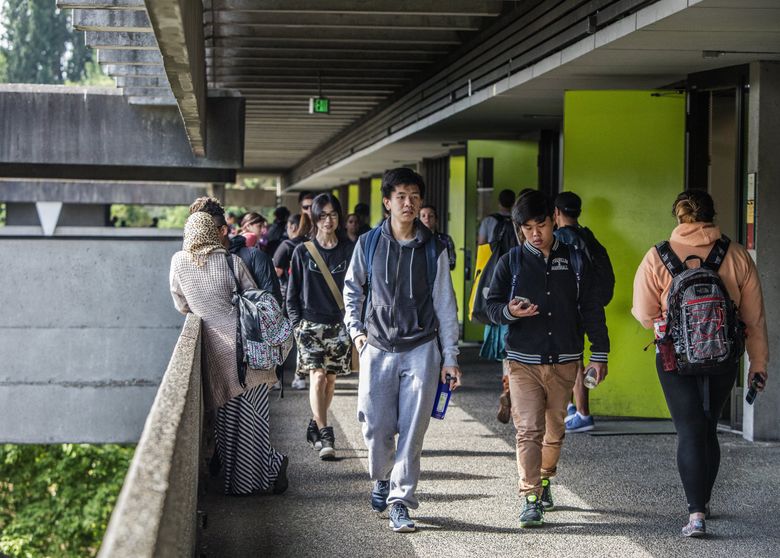 Students walk between classes at North Seattle College. It is one of three campuses that students will be able to choose from under a new program giving free tuition to high-school graduates.  (Steve Ringman / The Seattle Times)