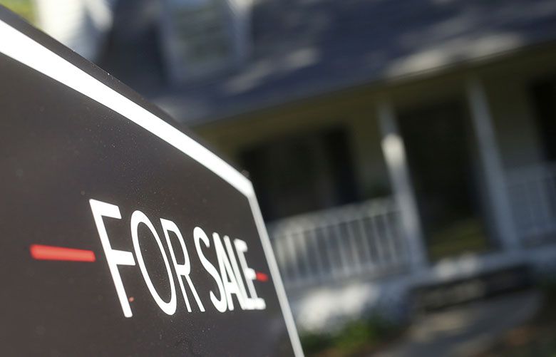 A for sale sign on a home. Mortgage rates  (AP Photo / John Bazemore, File)