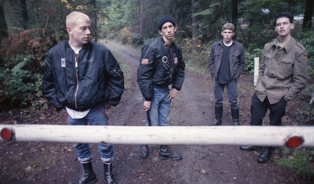 Skinheads guard the entrance to their campground at South Whidbey State Park during a December 1988 gathering to commemorate the 1984 death of white supremacist Robert Mathews. (Mike Levy / The Seattle Times, 1988)