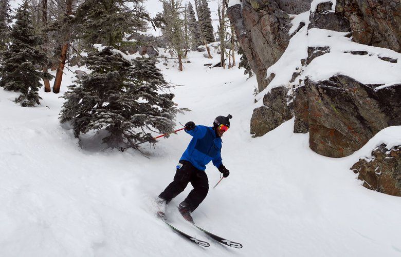 Skier Alec McNeil turns in fresh powder down the slopes of Shark Fin off Chair 4 at Lost Trail Powder Mountain.