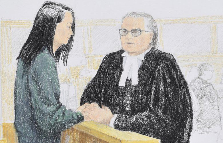 In this courtroom sketch, Meng Wanzhou, left, the chief financial officer of Huawei Technologies, speaks to her lawyer David Martin during a bail hearing at British Columbia Supreme Court in Vancouver, British Columbia, Monday, Dec. 10, 2018. (Jane Wolsak/The Canadian Press via AP) VCRD201 VCRD201