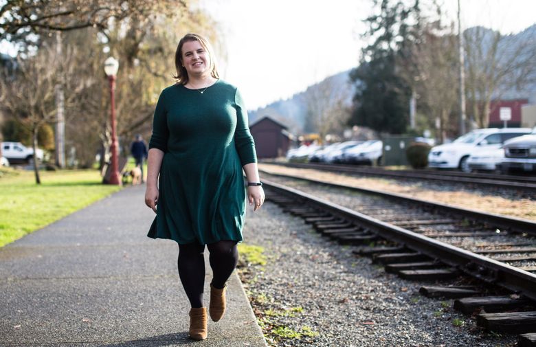 “I feel really grateful to be able to take advantage of this, and it’s coming at a time that makes sense for my family,” says Maia Knox of the state’s new family- and medical-leave law, which pays a portion or sometimes all of a worker’s salary for at least 12 weeks. (Rebekah Welch / The Seattle Times)