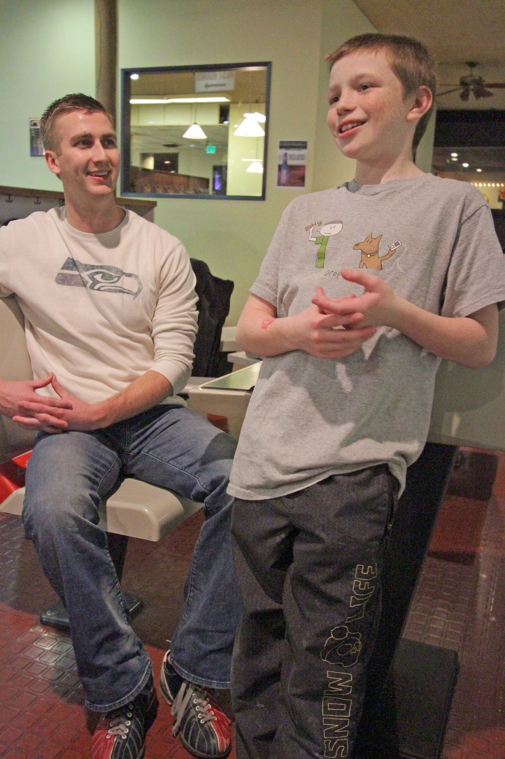 Bryce Hammond, shown in 2012 at age 11, bowls with his “Big Brother” Zach Hokett at Roxbury Lanes in West Seattle. (Greg Gilbert / The Seattle Times archives)