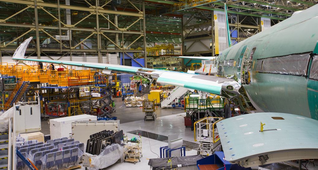 The wing of the new 777X, with the 11-ft wingtip folded up so it can fit inside the Everett assembly bay. It will similiarly be folded up to fit at airport gates. This airplane is the first 777X that will fly in 2019. (Mike Siegel / The Seattle Times)