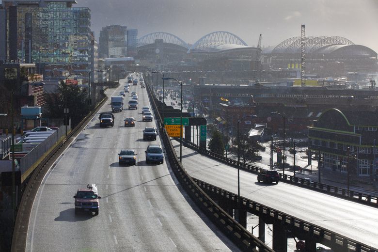 Traffic on the soon-to-be-demolished Alaskan Way Viaduct, photographed last month from Victor Steinbrueck Park. The viaduct will close  permanently Jan. 11, and the tunnel’s big opening party is Feb. 2-3. After the tunnel opens, the viaduct will be demolished. (Ellen M. Banner / The Seattle Times)