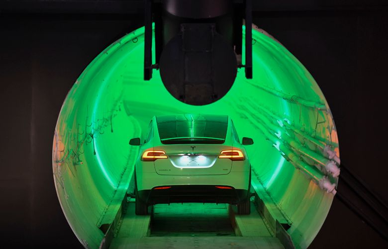 A modified Tesla Model X electric vehicle enters a tunnel before an unveiling event for The Boring Company Hawthorne test tunnel Dec. 18, 2018 in Hawthorne, Cal. On Tuesday night, The Boring Company will officially open the Hawthorne tunnel, a preview of Musk’s larger vision to ease traffic in Los Angeles. (Robyn Beck-Pool/Getty Images/TNS)**FOR USE WITH THIS STORY ONLY**  1260446 1260446