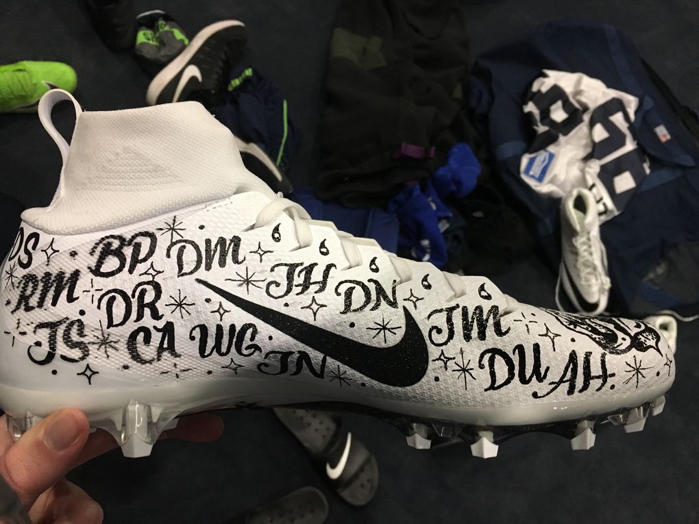 In last weekend’s win over San Francisco, Seahawks defensive lineman Quinton Jefferson wore the initials of gun violence victims on his cleat. (Mike Vorel/The Seattle Times)
