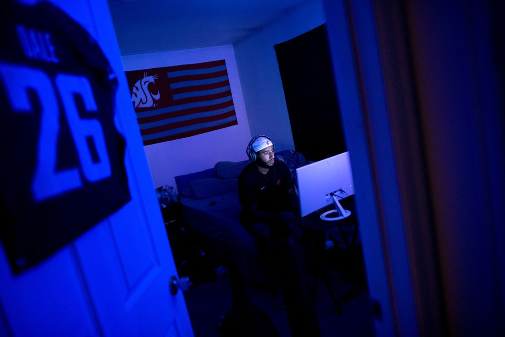 WSU safety Hunter Dale plays the popular video game Fortnite with teammates at his apartment in Pullman, Wash. (Tyler Tjomsland / The Spokesman-Review)