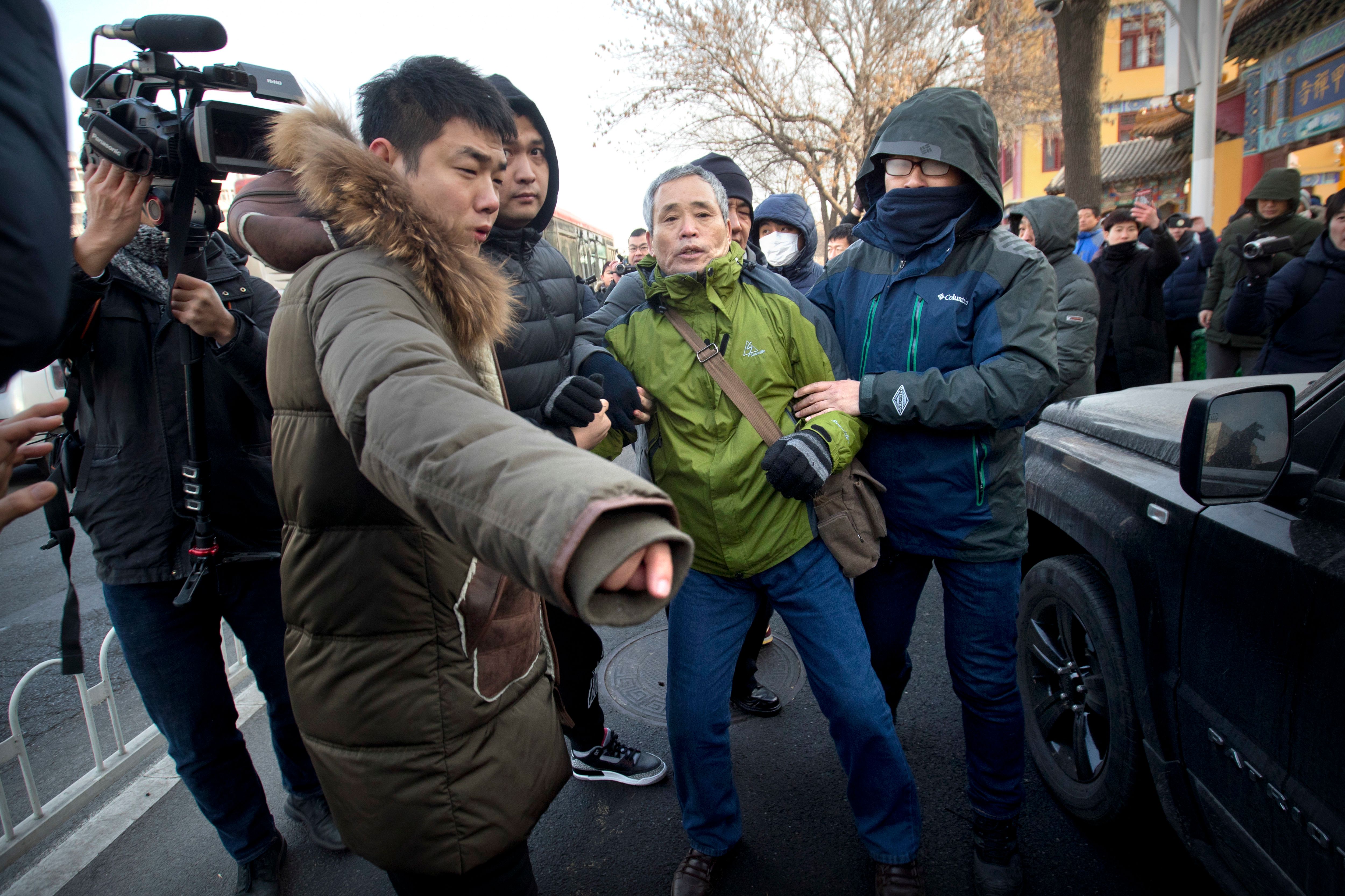 Prominent Chinese rights lawyer tried in closed proceedings The