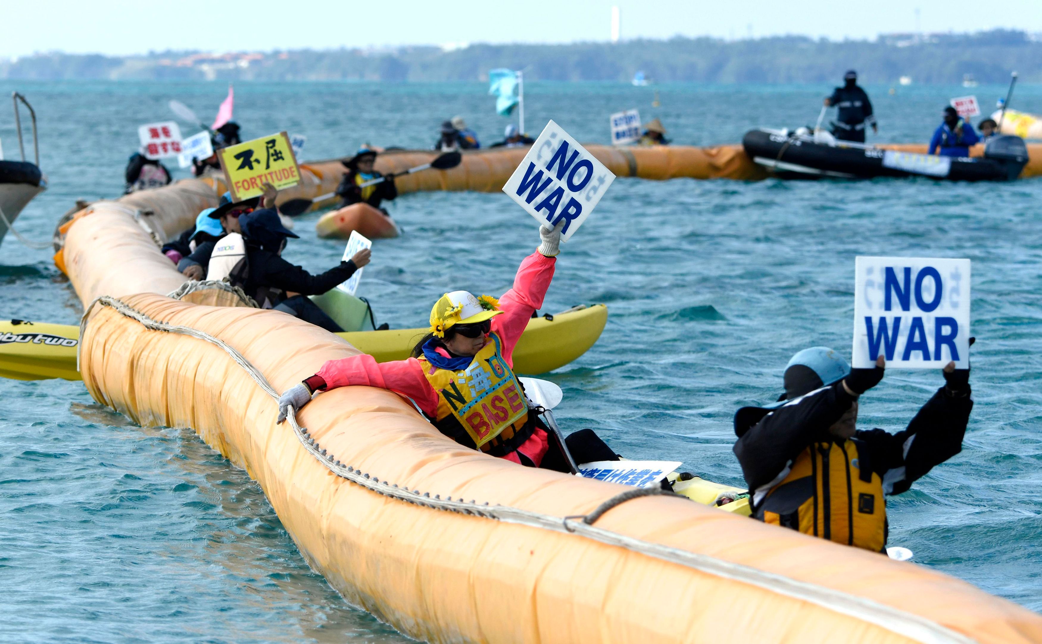 Japan begins reclamation at disputed US base despite protest | The