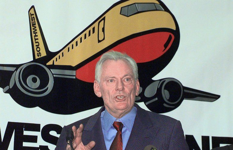FILE – In this Dec. 9, 1998, file photo, Southwest Airlines President and CEO Herb Kelleher speaks at a news conference at MacArthur Airport in Islip, N.Y. Not many CEOs dress up as Elvis Presley, settle a business dispute with an arm-wrestling contest, or go on TV wearing a paper bag over their head. Southwest confirmed Kelleher died on Thursday, Jan. 3, 2019. He was 87. (AP Photo/Ed Betz, File) 