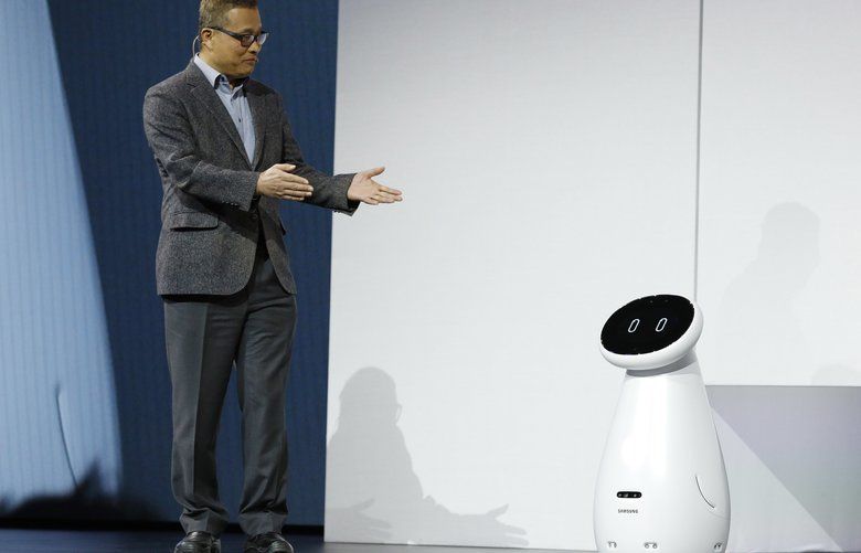 Gary Lee, senior vice president and head of the AI Center at Samsung Electronics, unveils the Bot Care robot during a Samsung news conference at CES International, Monday, Jan. 7, 2019, in Las Vegas. (AP Photo/John Locher) NVJL146 NVJL146