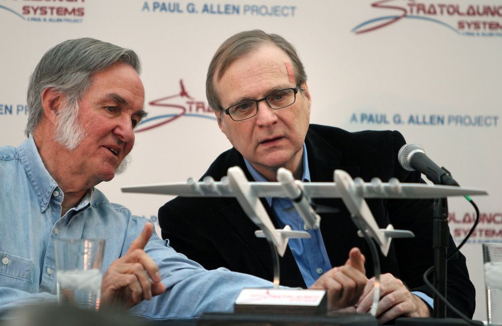 Aerospace entrepreneur Burt Rutan, left, and investor and philanthropist Paul Allen go over a mockup of the Stratolauncher in 2011. (John Lok / The Seattle Times)