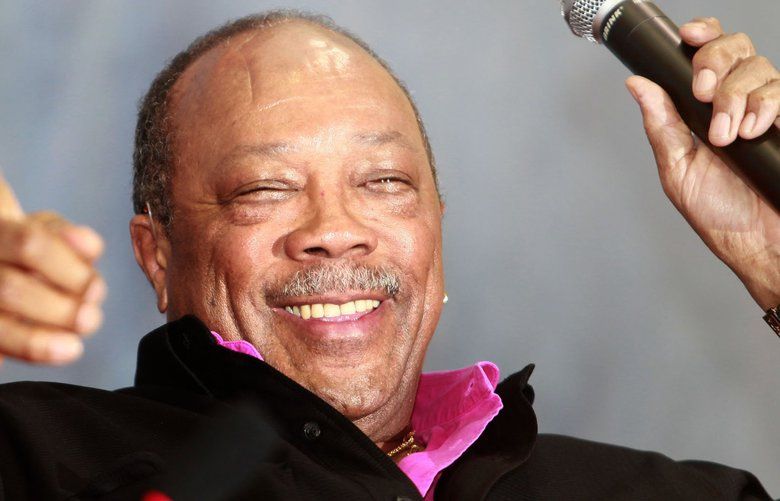 Multi-Grammy winning U.S. musician Quincy Jones gestures at an talk event at Fudan University Friday June 19, 2009 in Shanghai. China. Jones is in Shanghai to attend the 12th Shanghai International Film Festival. (AP Photo/Eugene Hoshiko) SHA113