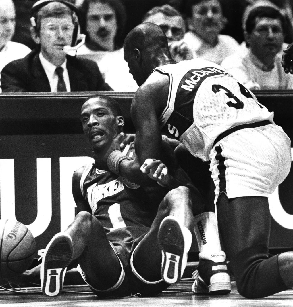 Xavier McDaniel of the Sonics gets a stranglehold on LA Laker Wes Mathews on Nov. 25, 1987.
(Harley Soltes / The Seattle Times)