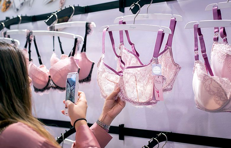 Underwear Store Display Stand Against The Wall Bra Is Hanging On
