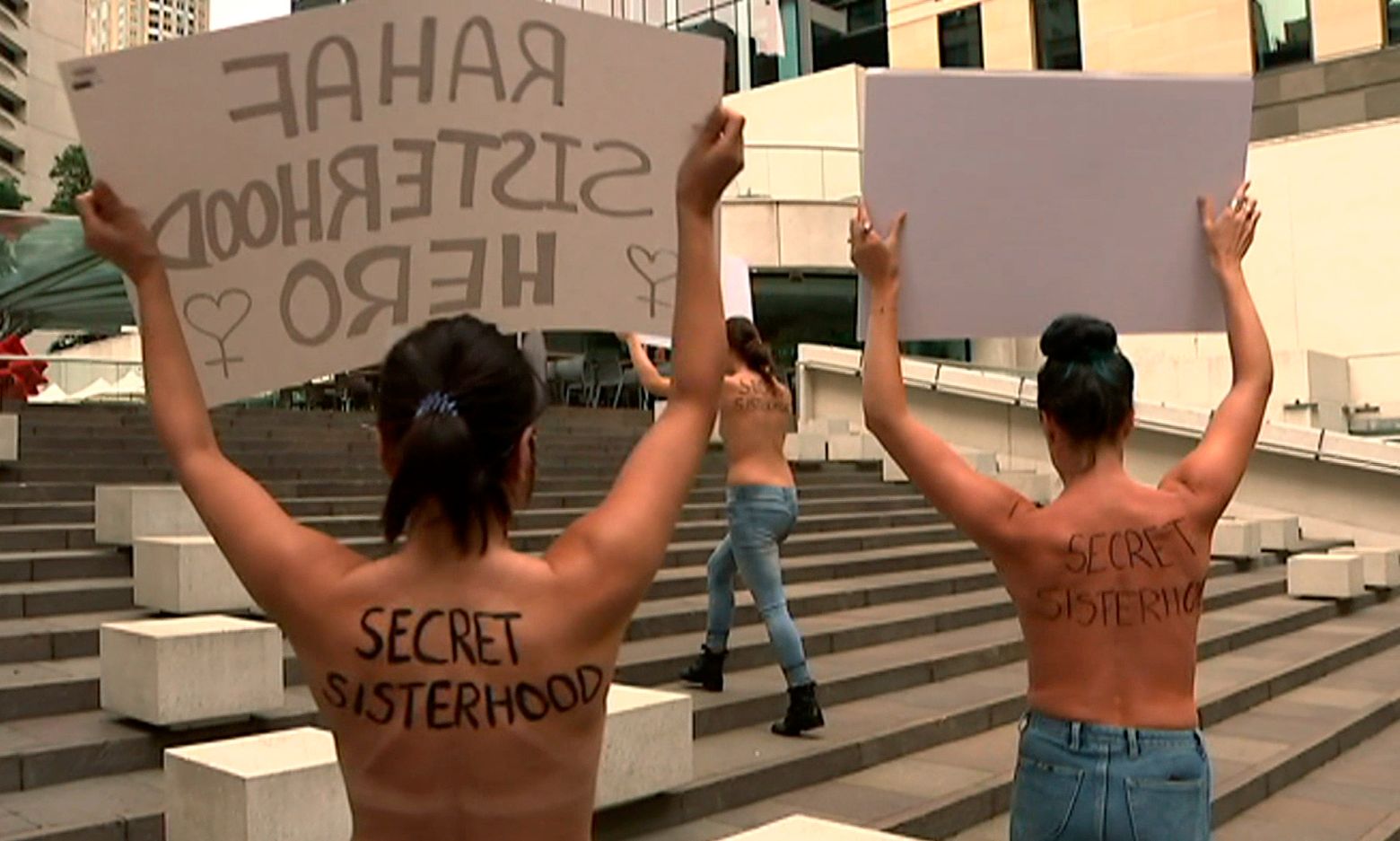 Australians hold topless protest in support of Saudi runaway | The Seattle  Times