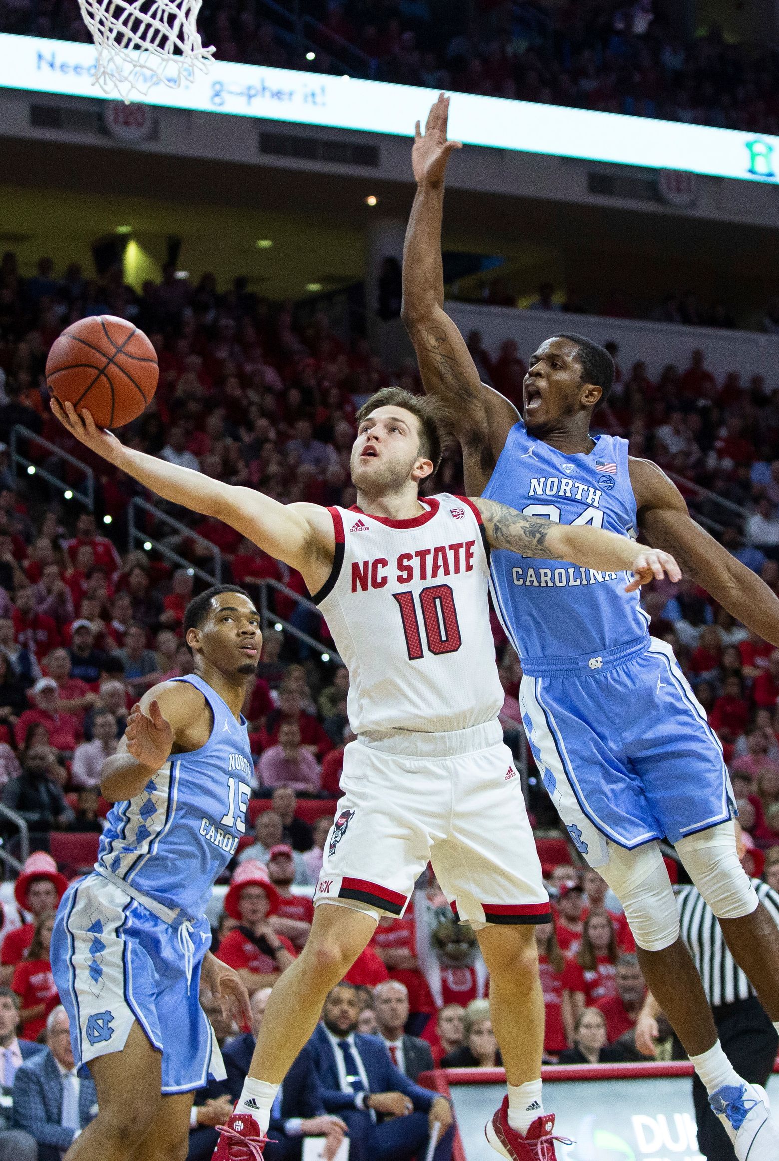 No. 12 UNC beats No. 15 NC State 90-82 in rivalry game | The Seattle Times