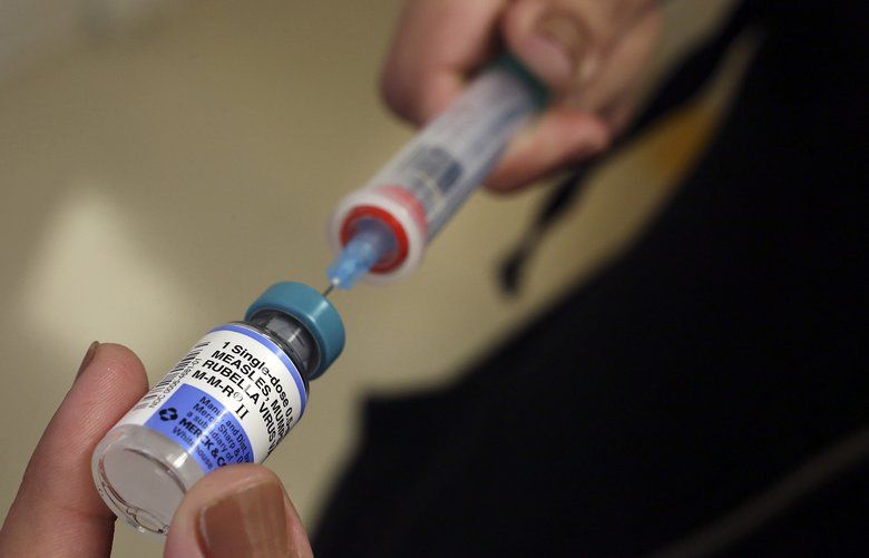 A vial containing the MMR vaccine is loaded into a syringe before being given to a baby at the Medical Arts Pediatric Med Group in Los Angeles on February 6, 2015. (Mel Melcon/Los Angeles Times/TNS) 1265357 1265357