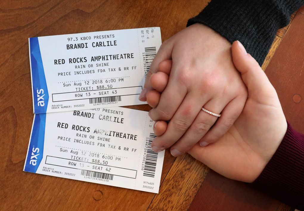 Karen Gray and Lisa Nielsen kept the tickets from the Brandi Carlile concert at which they became engaged. Nielsen gave Gray this engagement ring after proposing at Red Rocks Amphitheatre outside of Denver last year. (Ken Lambert / The Seattle Times)