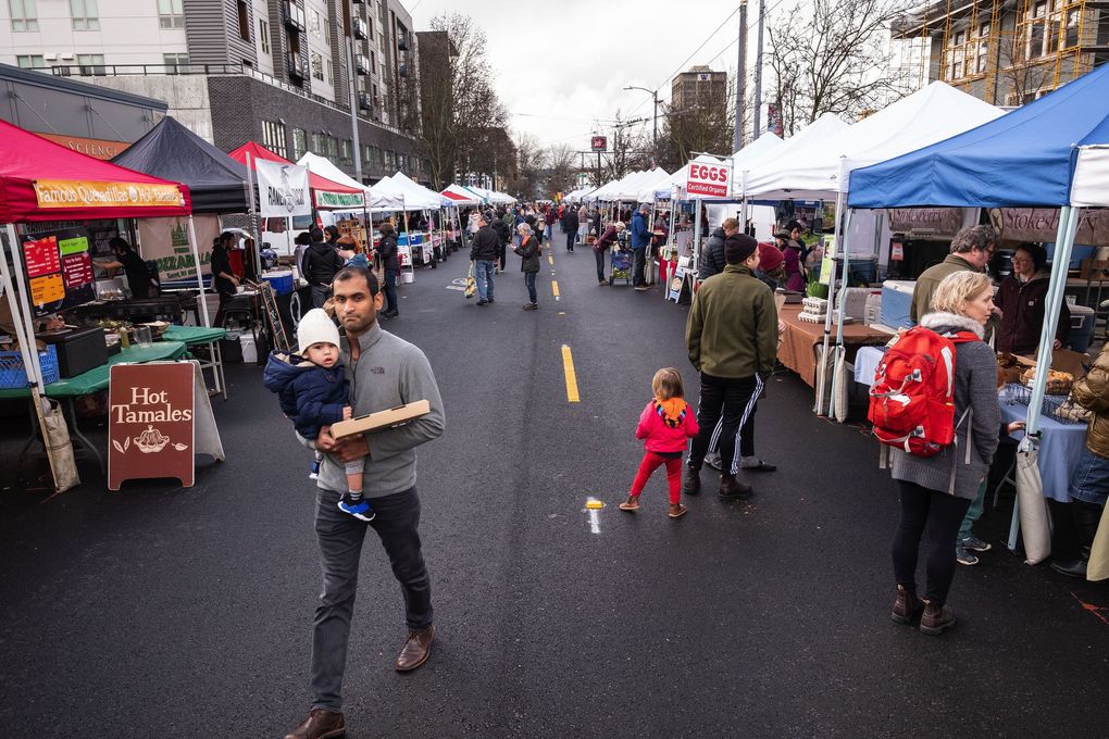 Shorter lines in winter make it an ideal time to chat with vendors. (Dean Rutz / The Seattle Times)