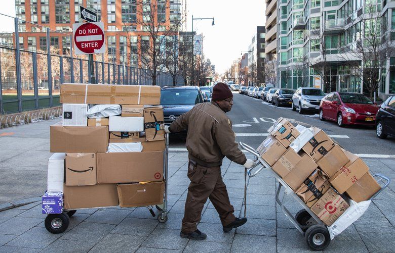 A UPS driver delivers packages along Center Boulevard in Long Island City, Queens, Feb. 14, 2019. Amazon said on Thursday that it was canceling plans to build its corporate campus in Long Island City. The deal had run into fierce opposition from local lawmakers who criticized providing subsidies to one of the world’s richest companies. (Benjamin Norman/The New York Times)