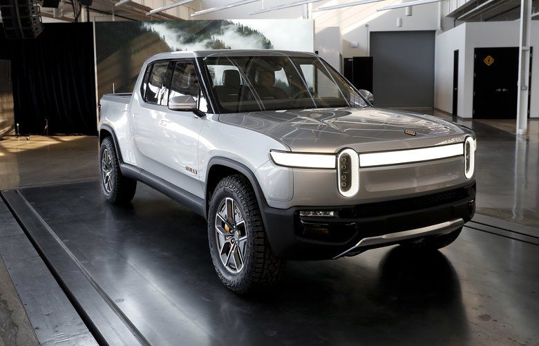 This Wednesday, Nov. 14, 2018, photo shows Rivian R1T at Rivian headquarters in Plymouth, Mich. The company, which plans to start selling vehicles in two years, is another in a growing line of startups and established automakers looking to break into the fully electric vehicle market and take sales from Tesla Inc., the current leader. (AP Photo/Paul Sancya)