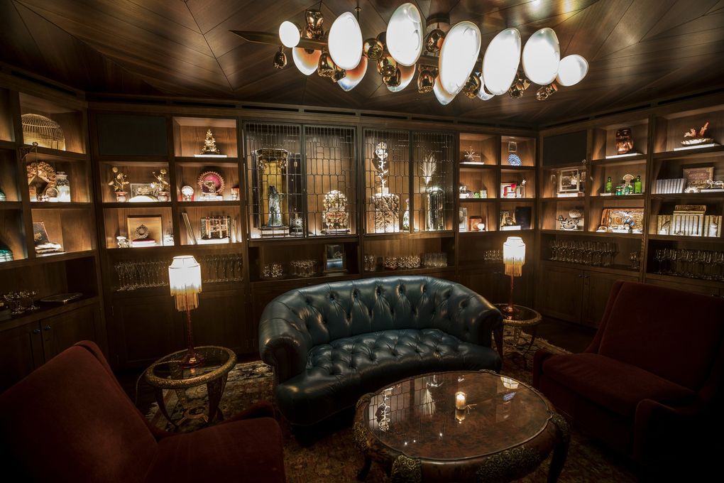 The dramatic decor of the new bar and restaurant Deep Dive dazzles underneath the Amazon Spheres. (Bettina Hansen / The Seattle Times)