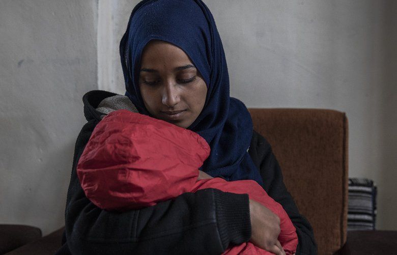 Hoda Muthana, who was born in the United States and joined the Islamic State four years ago, with her son at a detention camp in Al-Hawl, Syria, Feb. 17, 2019. Secretary of State Mike Pompeo said Feb. 20, that Muthana did not qualify for citizenship and had no legal basis to return to the country. (Ivor Prickett/The New York Times) XNYT117 XNYT117