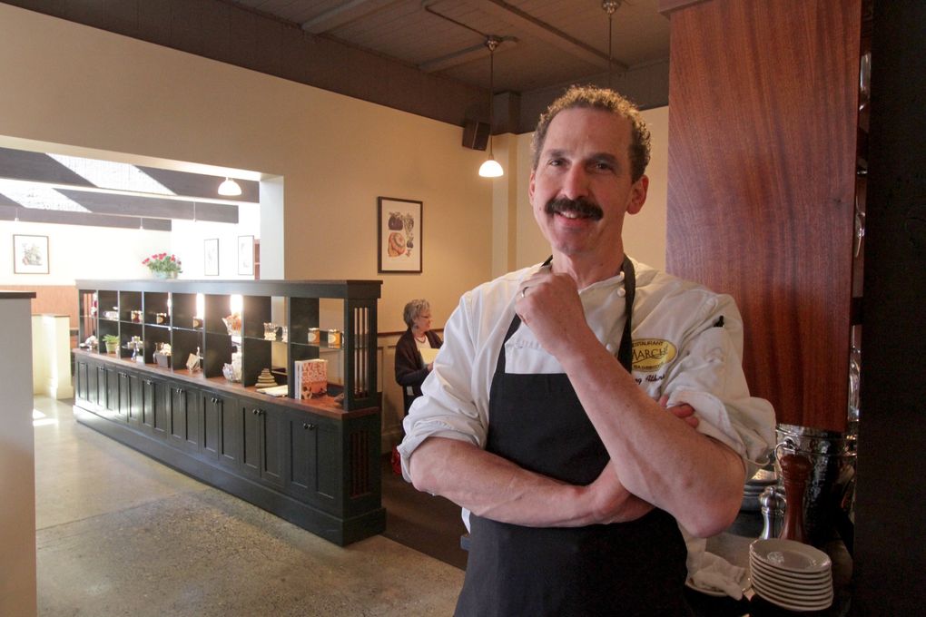 Chef Greg Atkinson, owner of Restaurant Marché on Bainbridge Island, says he initially feared the “silence of a cathedral” but also wants to moderate sound levels at his restaurant so that his guest can hear each other. (Greg Gilbert / The Seattle Times, 2013)