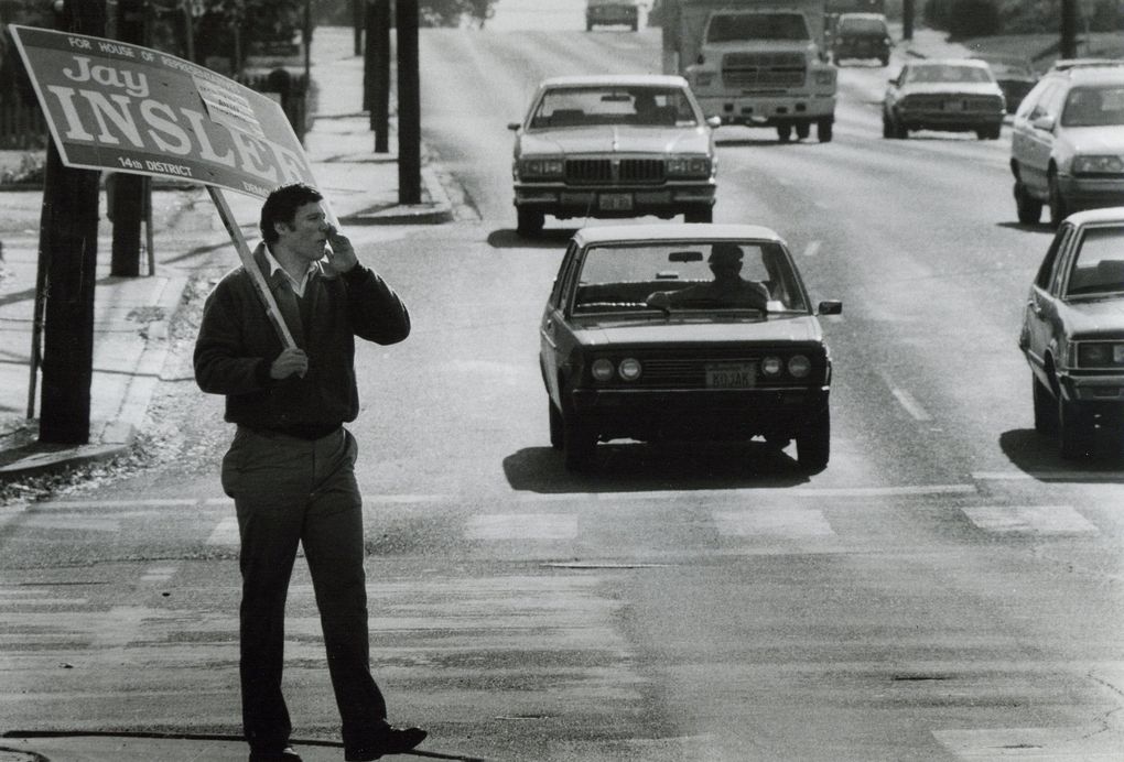 Jay Inslee, candidate for a 14th District House seat in Central Washington, urges passersby to remember his name in the voting booth on Nov. 9, 1988. (Roy Musitelli / Yakima Herald-Republic)