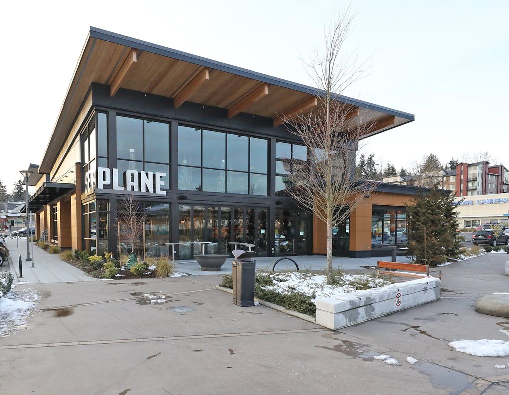 Seaplane sits across a plaza from The Hangar at Town Square, Kenmore’s community gathering place. (Greg Gilbert / The Seattle Times)