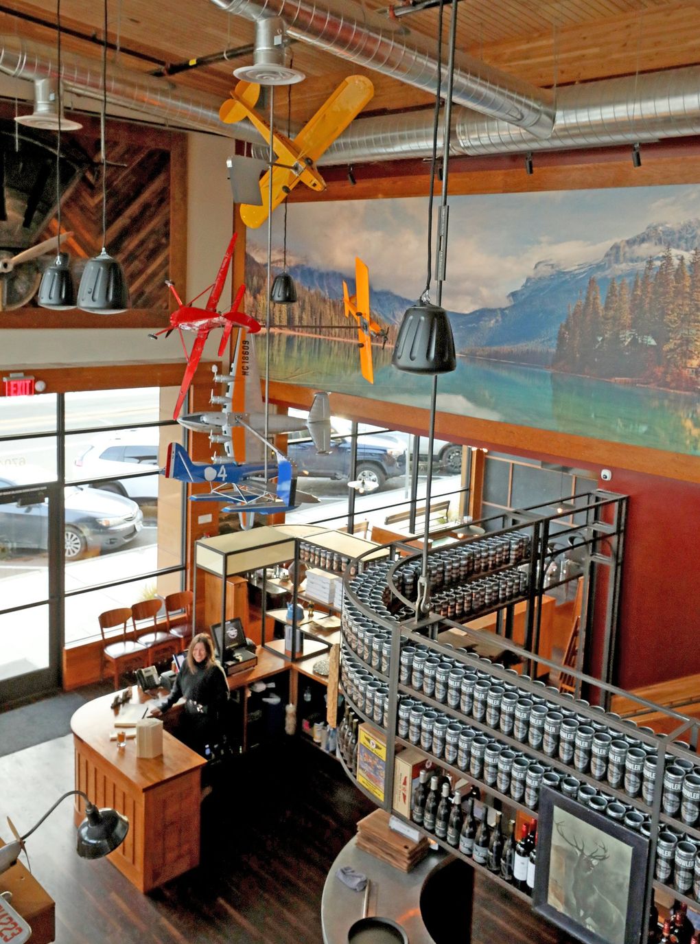 Seaplane’s interior is decorated with model airplanes hanging from the ceiling and small airplane models on the shelves around the restaurant. (Greg Gilbert / The Seattle Times)