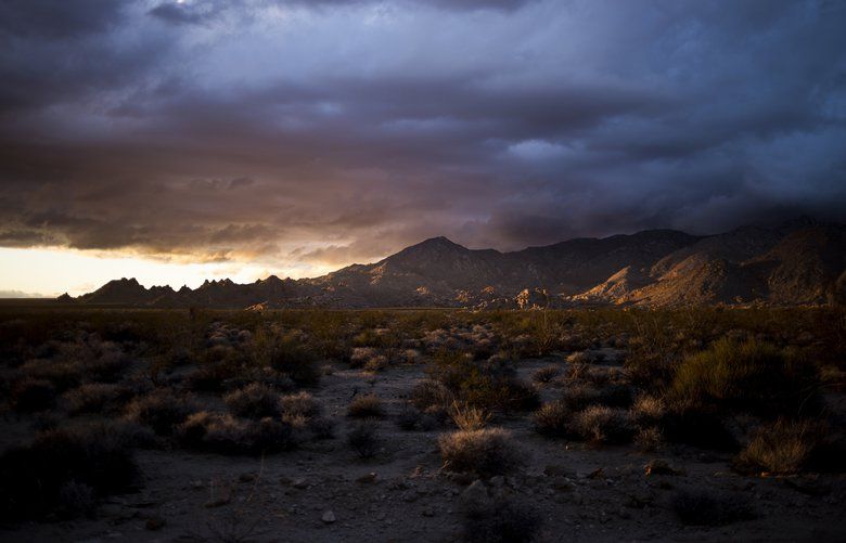 The sun sets on the Mojave National Preserve in Kelso, Calif., on Feb. 5. The public lands bill passed by the Senate Tuesday would connect the preserve with Death Valley National Park. MUST CREDIT: Photo for The Washington Post by Jenna Schoenefeld