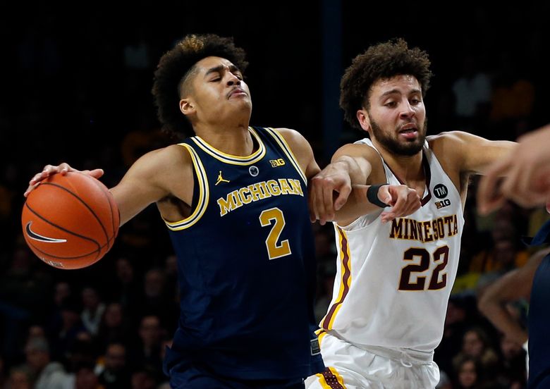 Michigan's Charles Matthews, Ignas Brazdeikis, Jordan Poole