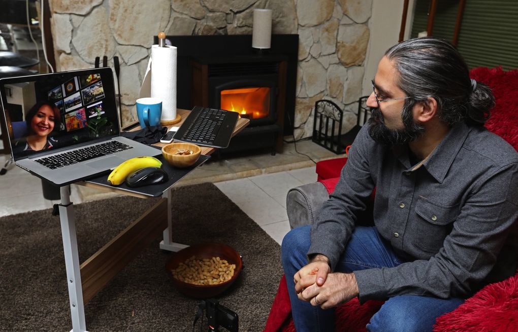 Rad Cyrus and his wife, Aghdas Mohammadkhani, talk for hours every day. Sometimes they watch movies or TV together. Sometimes, she paints while he drums. (Ken Lambert / The Seattle Times)