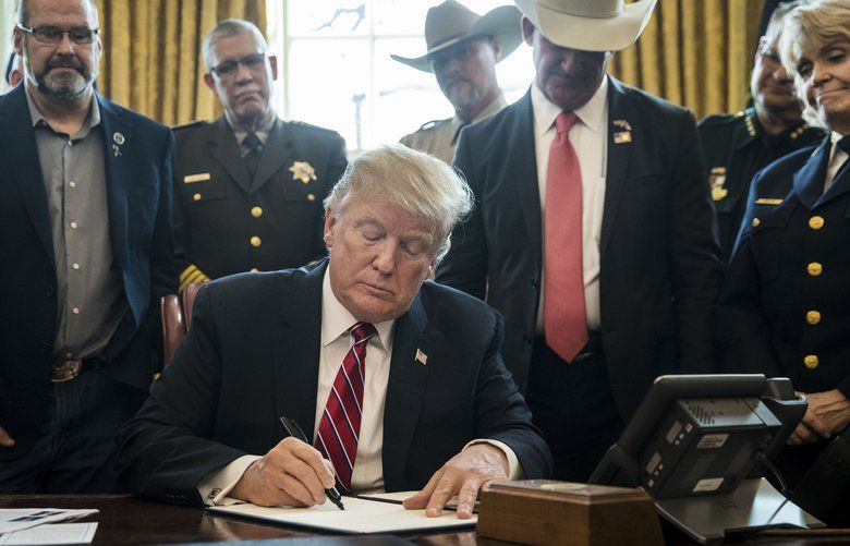Trump issues first veto after rebuke of border order | The Seattle Times