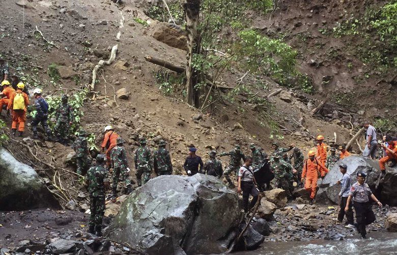 Flash floods, earthquake in Indonesia kill over 80 | The Seattle Times